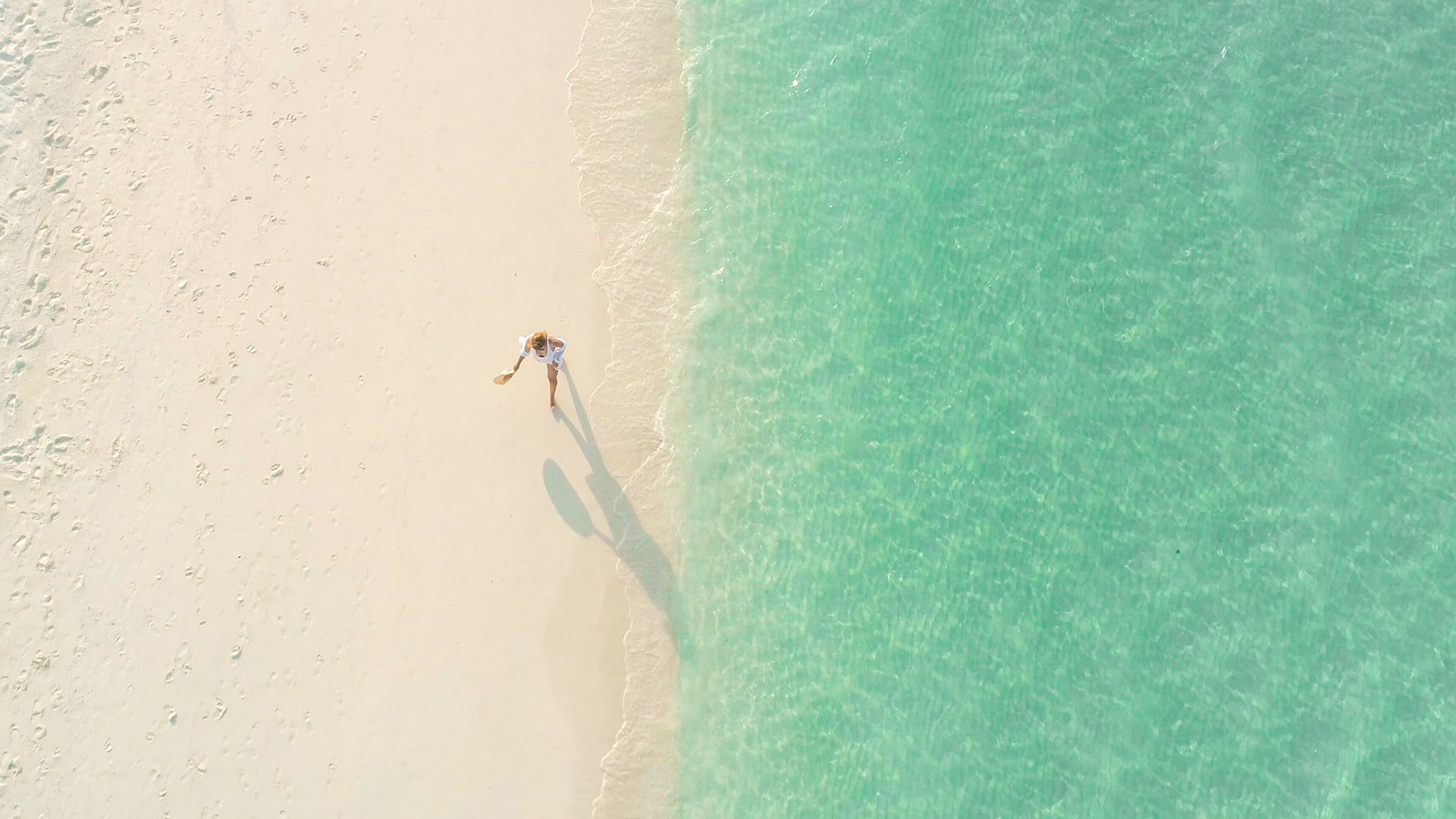 woman walking the sarasota beach