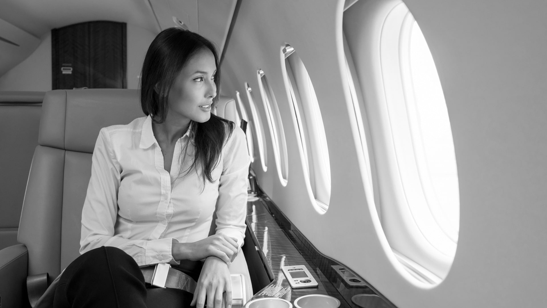 Woman on a private jet to One Park